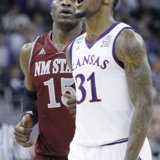Jamari Traylor reacts to a big play in Kansas' 75-56 win over New Mexico State.