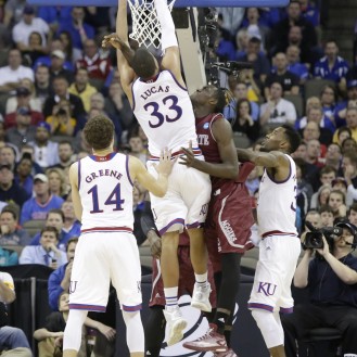 Landen Lucas is fouled as he goes up for a layup in Kansas' 75-56 win over New Mexico State.