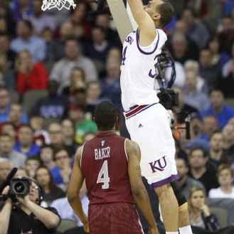 Perry Ellis skys for a dunk in Kansas' 75-56 win over New Mexico State.